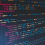 Lines of colorful code on a dark screen, illustrating free AI coding assistants for beginners